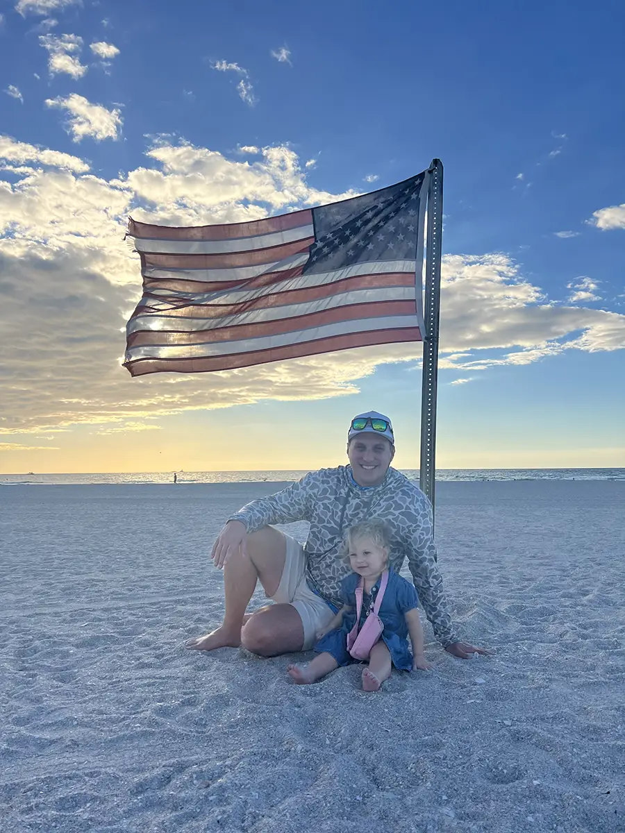 Brad Fitzgerald on beach with family