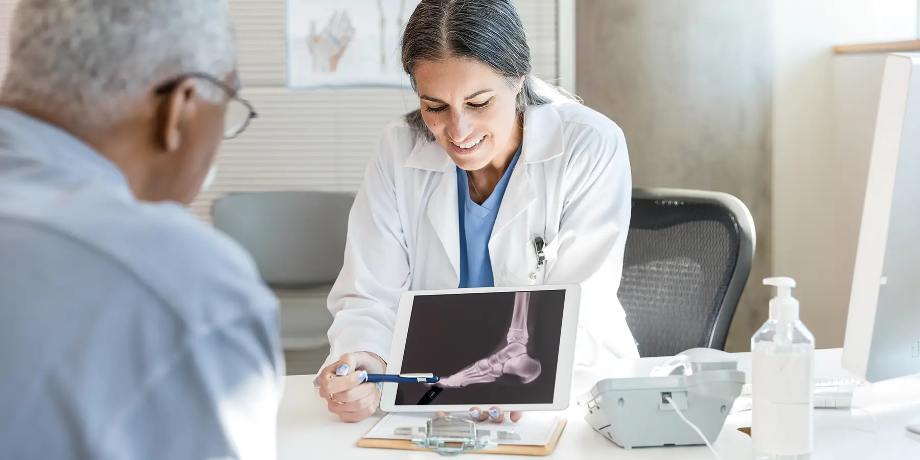 Doctor consulting patient with x-ray image