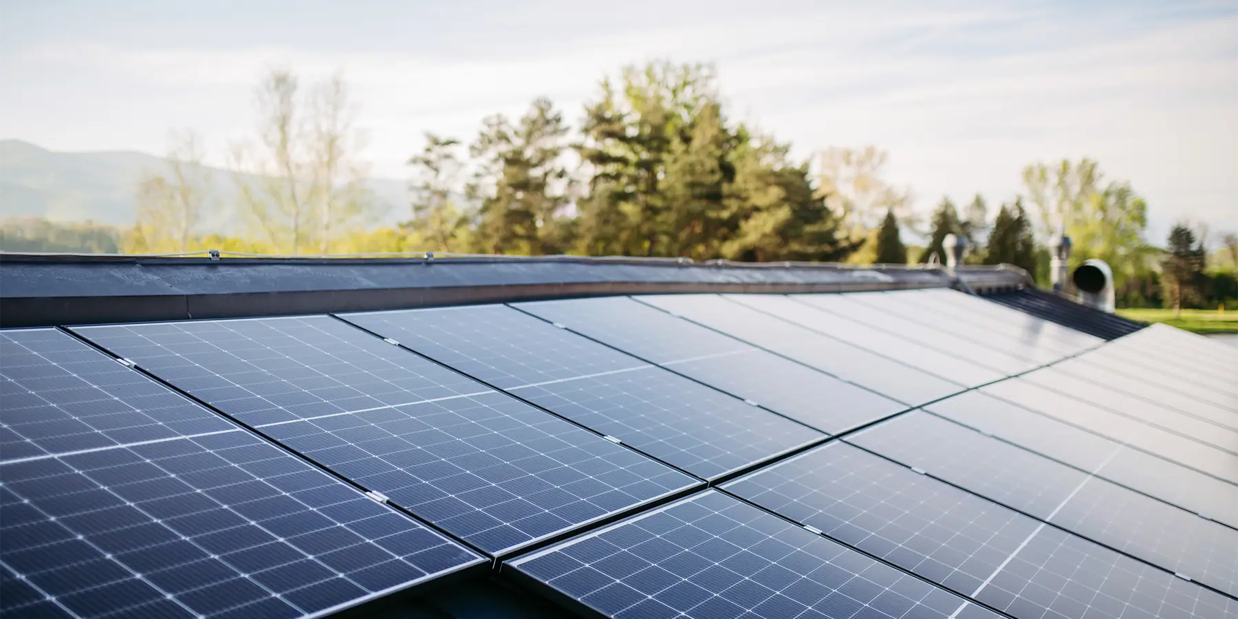 Rooftop solar panels on sunny day