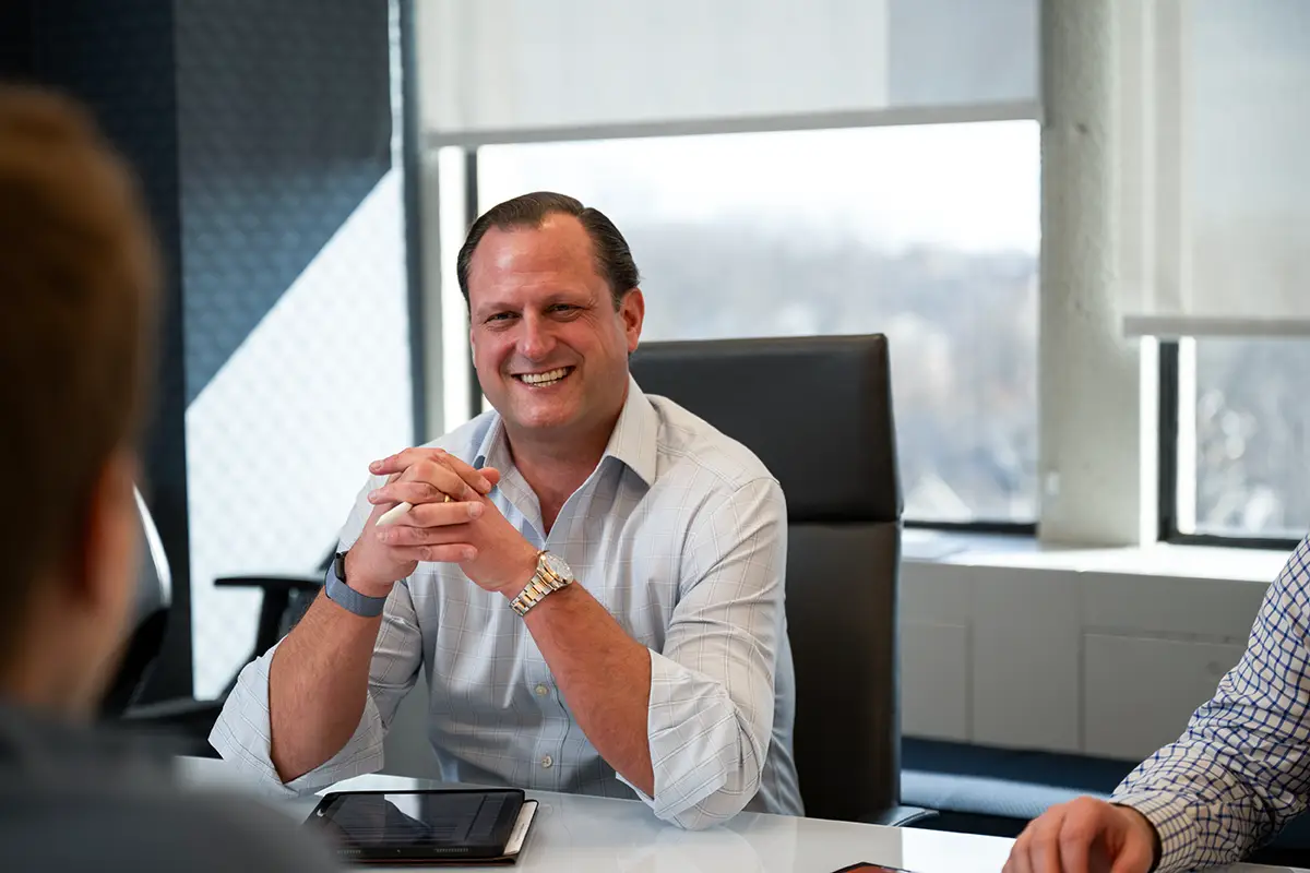 Compass Group employees meeting in conference room 