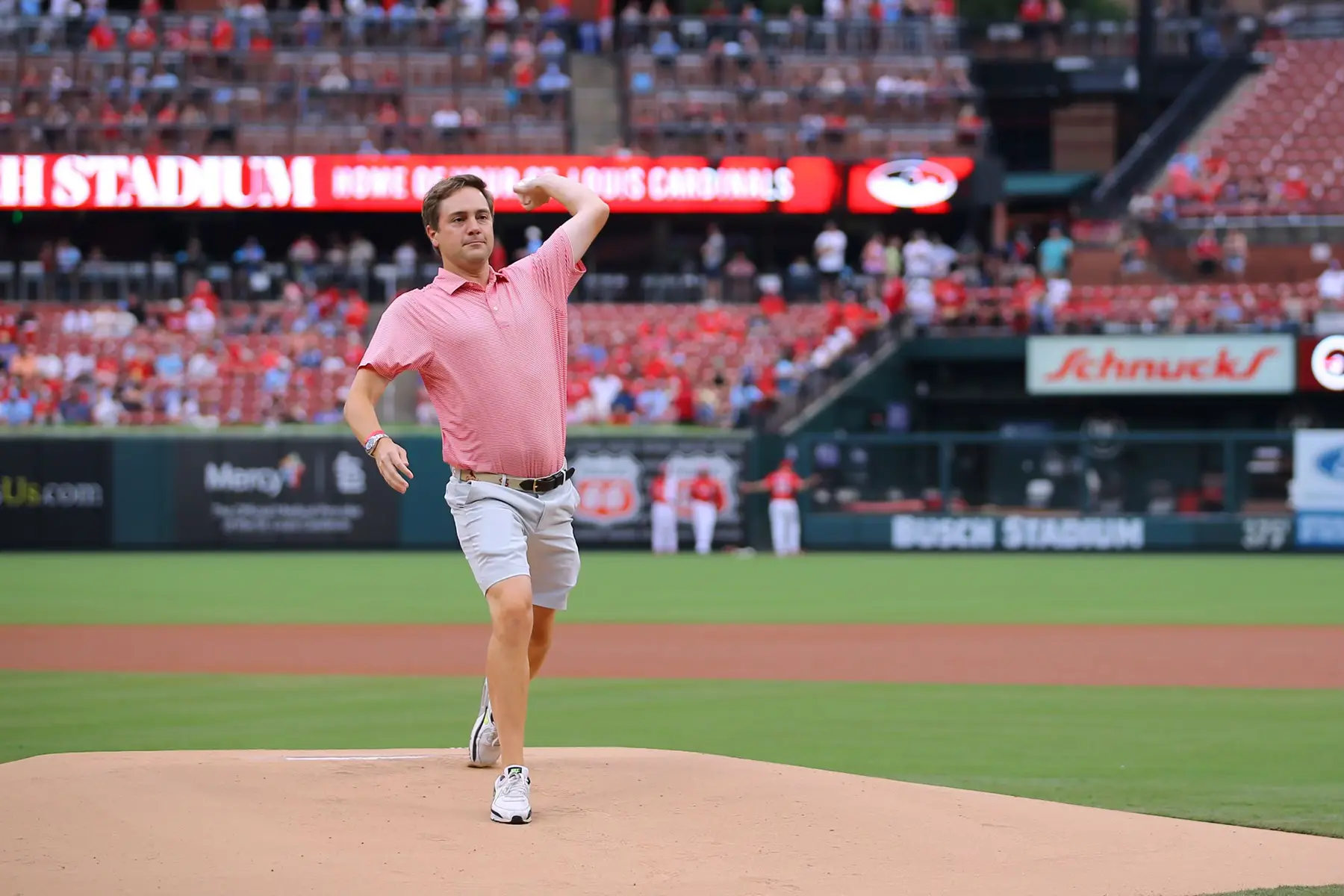 John throwing first pitch at Cardinal's game