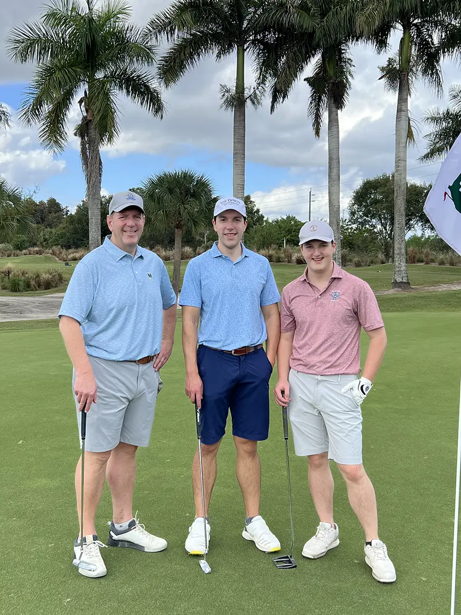 John Huhn golfing with sons