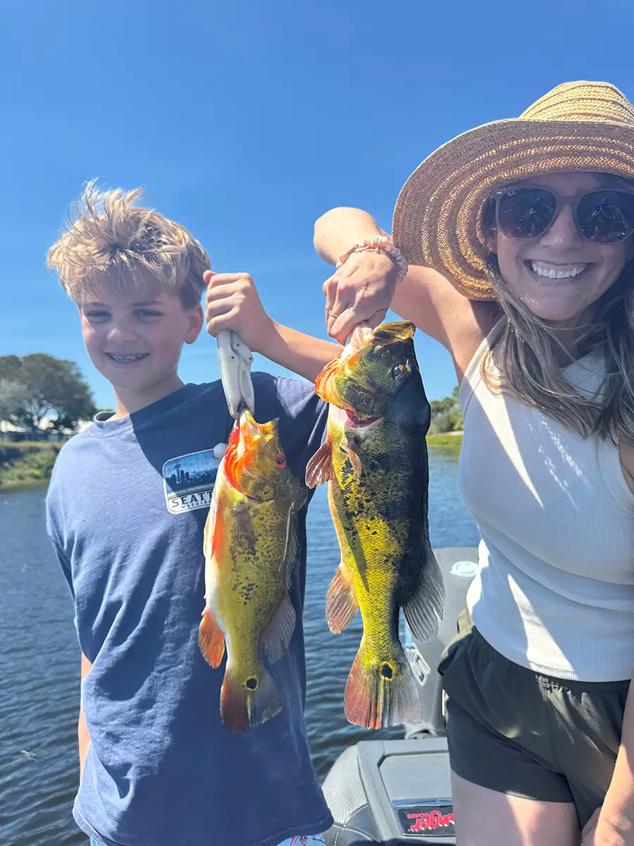 Katie Cason holding fish with son