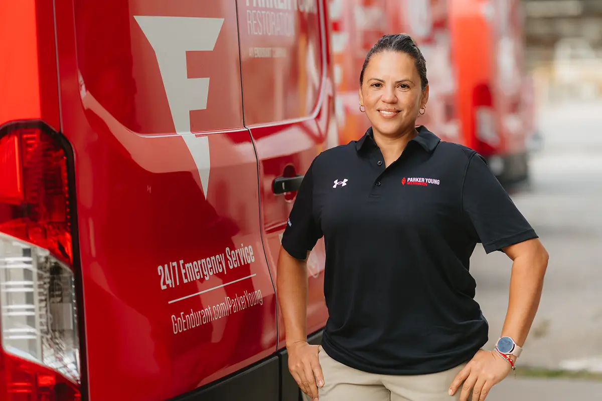 Endurant employee standing with truck